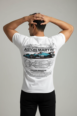 Person wearing a white t-shirt with Aston Martin branding and car graphics on a gray background