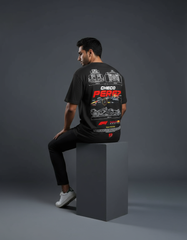 Person wearing a black t-shirt with branding on a gray background